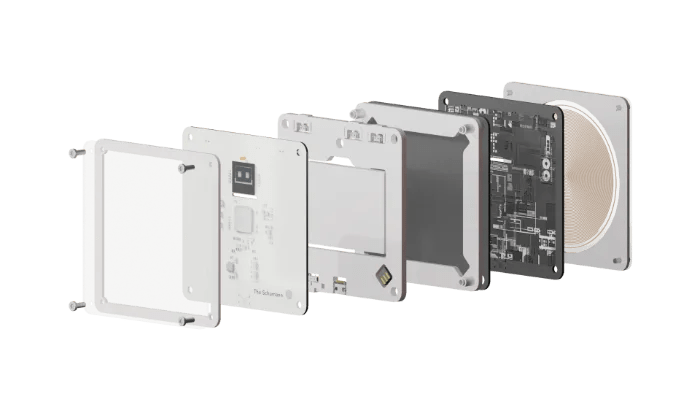 Exploded view of The Schumann: front frame, display board, connector board, battery tray, circuit board and Mobius coil